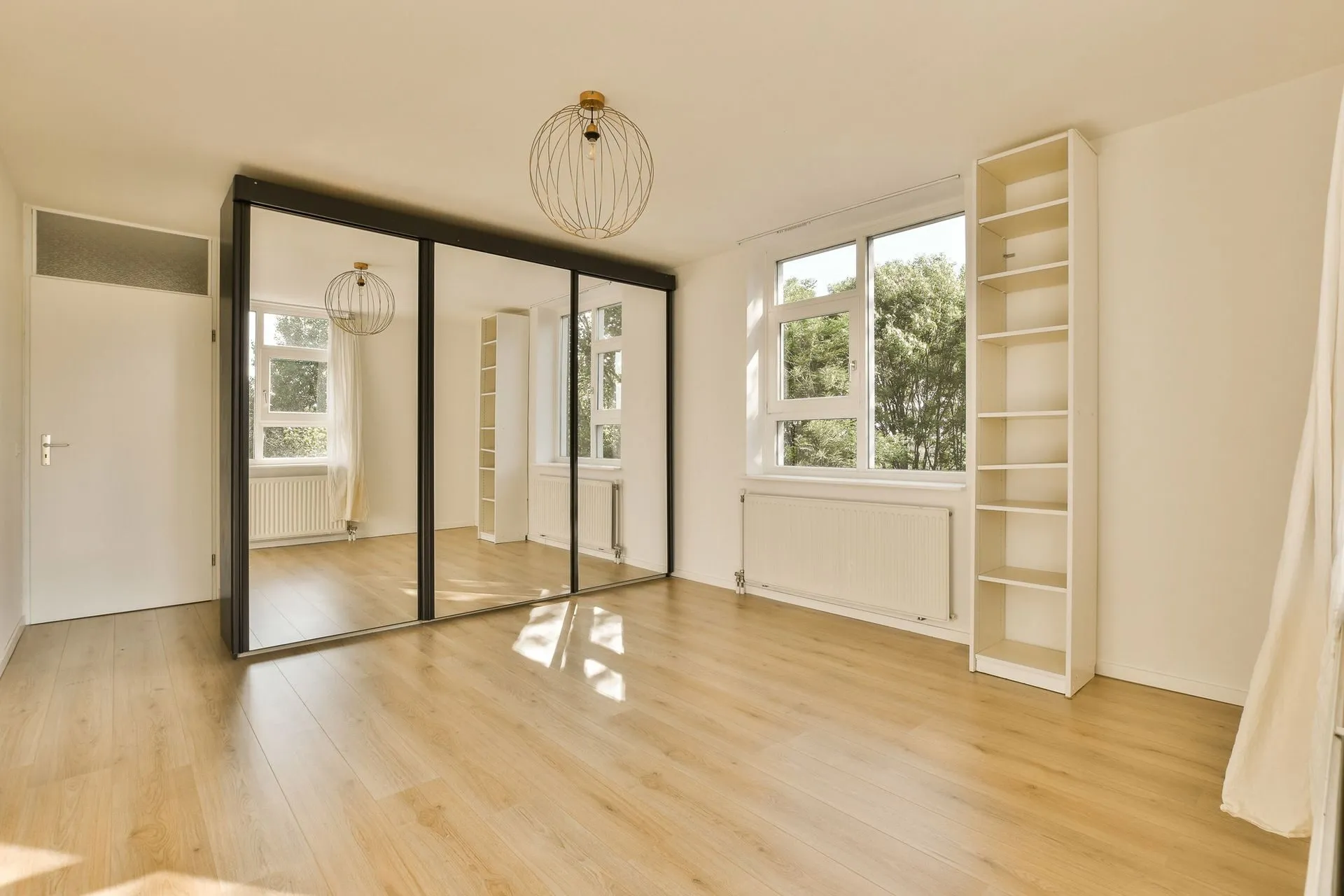 Hinged mirror doors in a walk-in conversion